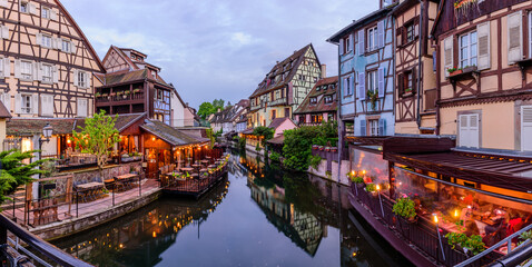 Sightseeing of France. Amazing colorful traditional half timbered houses in Colmar old town, beautiful night view, Colmar, Alsace, France