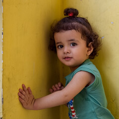 Fototapeta premium Cute little boy Shivaay at home balcony during summer time, Sweet little boy photoshoot during day light, Little boy enjoying at home during photo shoot