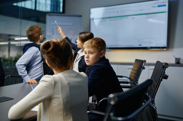 Children employees talking at team office meeting