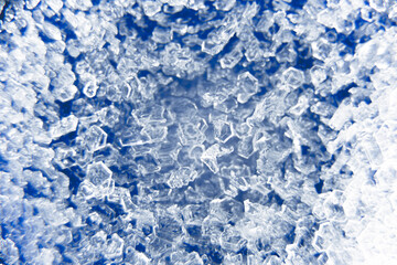 Macro close up of ice crystals on a blue background. 3d visual depth. Color abstract grunge...