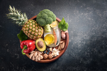 Collection of healthy food with anti-inflammatory and antioxidant on a wooden plate, immune system...