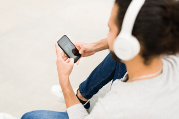 Hispanic man enjoying music