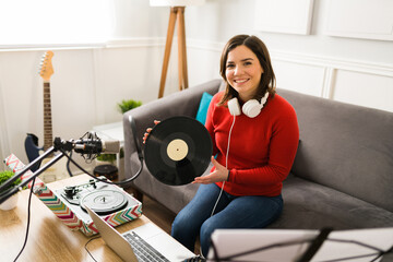 Gorgeous woman using a vinyl record player