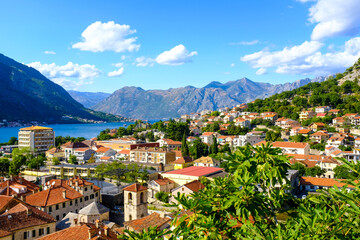 Fototapeta premium Kotor Montenegro. Boko Kotor Bay panoramic view. Beautiful summer day with blue sky and clouds. 