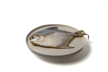 white pomfret on a white background