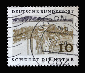 Obraz premium Stamp printed in Germany showing a landscape: lowland, European Nature Preservation Year, circa 1969
