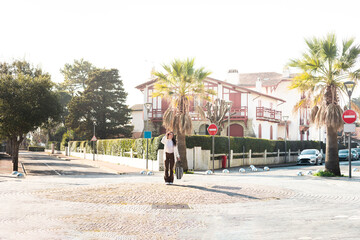 Young caucasian woman in the middle of a roundabout with puzzled face.