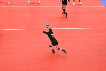 Volleyball player passing the ball to the setter