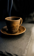 Obraz na płótnie Canvas clay cup with tea