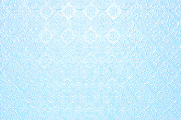 Textured pale light blue faded background with a pattern of painted glass in vintage style wall