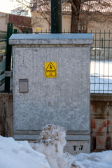 electrical panel standing on the street and warning signs on it, electrical panel box,
