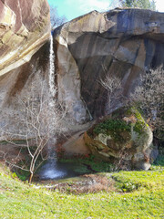 The beautiful waterfall springs from the rock where the legend says that a giant sleeps near the Corbii de Piatra Monastery.