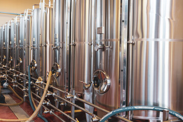 a row of metal tanks in the production of alcohol