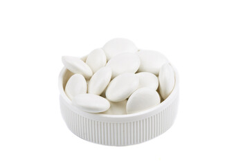 Medical pills in a plastic cap isolated on a white background.