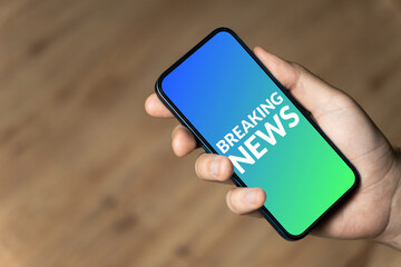 Breaking News - hand holding a phone