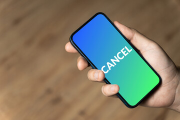 Cancel - hand holding a phone