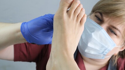 Patient on medical pedicure procedure, visiting podiatrist.Professional hardware pedicure using...