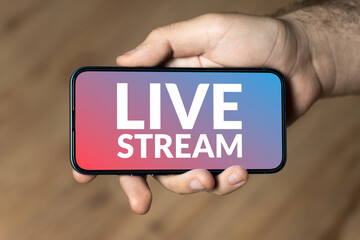 Live Stream - hand holding a phone