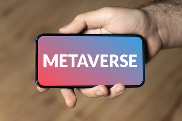 Metaverse - hand holding a phone