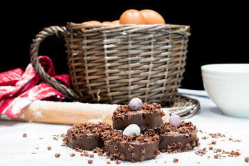 Chocolate easter cakes and bakery utensils ready for easter baking. All the eggs in one basket
