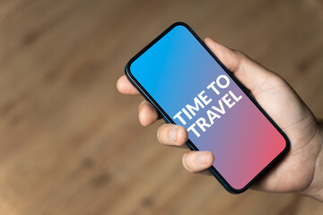 Time To Travel - hand holding a phone