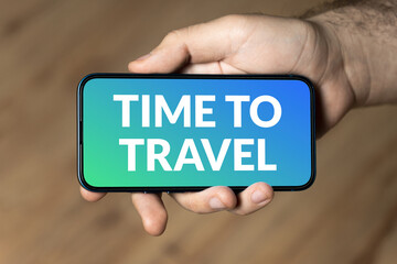 Time To Travel - hand holding a phone