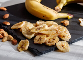 Banana chips on a slate board