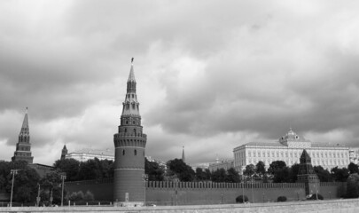 Walls and towers of the Moscow Kremlin. View of the main object of power in Russia. Black and white photo.