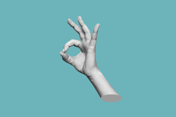 Female hand showing the ok gesture isolated on a blue color background. Trendy abstact 3d collage...