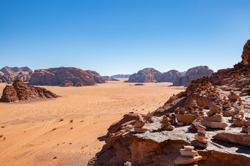 Wadi Rum in southern Jordan. It is located about 60 km to the east of Aqaba. Wadi Rum has led to its designation as a UNESCO World Heritage Site and is known as The Valley of the Moon.