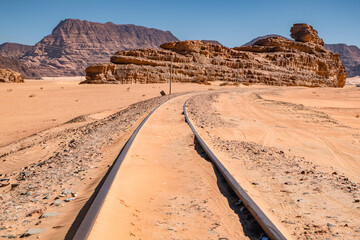 Railway tracks against a setting sun in Wadi Rum, Jordan