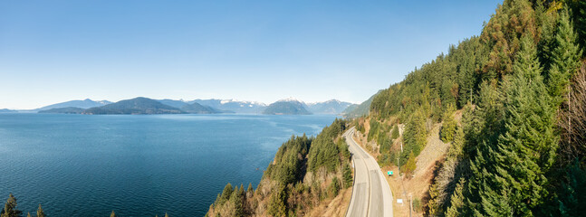 Aerial Panoramic View of Sea to Sky Highway on Pacific Ocean West Coast. Sunny Winter Day. Located...