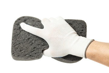Hand in gloves holding sponge isolated on a white background