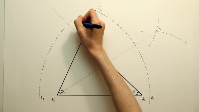 Young mathematician hand marks a points "E3" and "E4" on the arc of circle. Date of shooting day 26 January 2022 year, MSK time. This video was filmed in Russia.