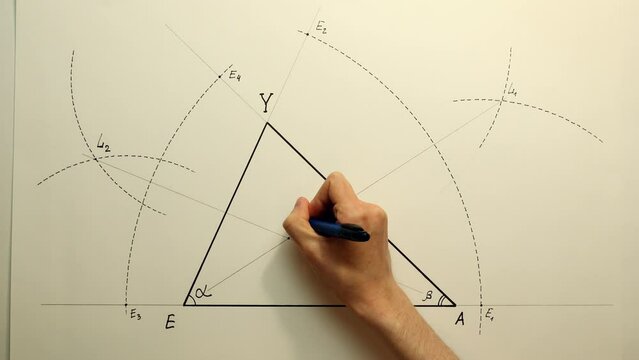 Young mathematician hand marks incenter of a triangle. Date of shooting day 26 January 2022 year, MSK time. This video was filmed in Russia.