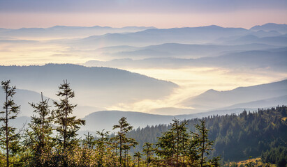 Beautiful sunrise in the Carpathians. Hills lines during sunrise. Beautiful natural landscape. Vibrant photo. Panoramic view.