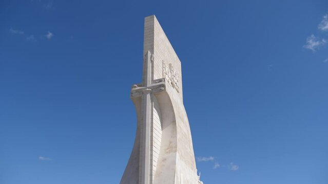 tourists walking near the monument to the discoveries in Lisbon slow motion 4k