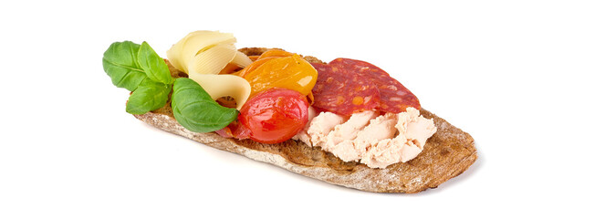 Bruschetta with chorizo and gouda cheese, isolated on white background. High resolution image.