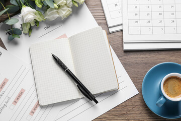 Flat lay composition with Wedding Planner on wooden table
