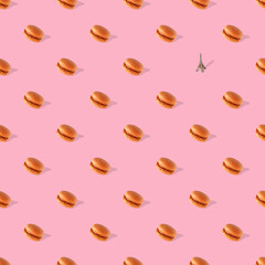 macaroons with shadow on pink background, seamless pattern