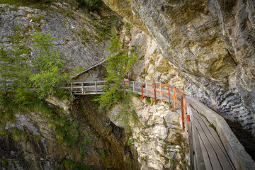 Adrenaline walking trail following historic irrigation channel on the cliffs Bisse du Ro close to Crans Montana