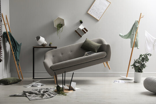 Chaotic living room interior during strong earthquake