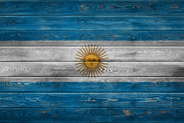 The national flag of Argentina. is painted on a camp of even boards nailed with a nail. The symbol of the country.