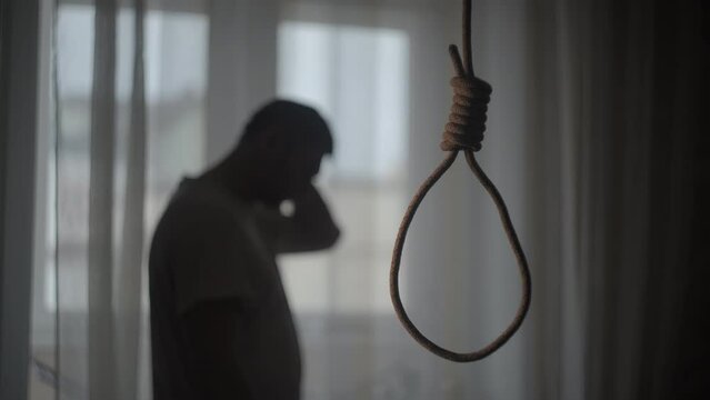 Depressed man contemplating suicide