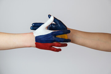 Hand painted in the colors of the flag of Russia and Ukraine. 