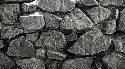 Black and white image of a stone wall.