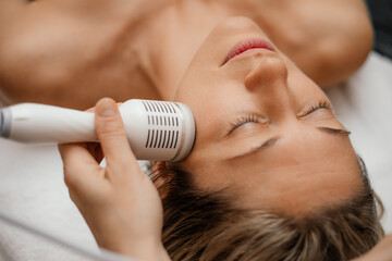 Woman relax beauty therapy spa salon. Attachments device Hydra Facial skin care machine. Anti aging wrinkle. Close up