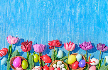 eggs and tulips easter wooden background