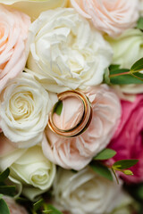 gold wedding rings on the wedding day for the newlyweds. Jewelry from expensive metal