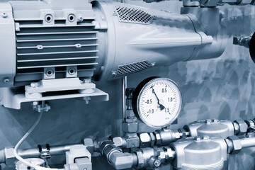 Pressure meters, pipes, filter,  faucet valves of heating system in a boiler room